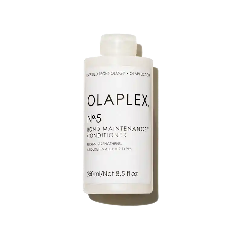 Olaplex No.5 Bond Maintenance Conditioner bottle on a bathroom counter, anti-frizz conditioner for damaged color-treated hair